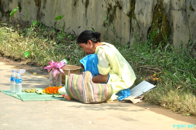 A women vendor selling flowers on the eve of Bor Festival near Hiyangthang Lairembi on Oct 12, 2013 