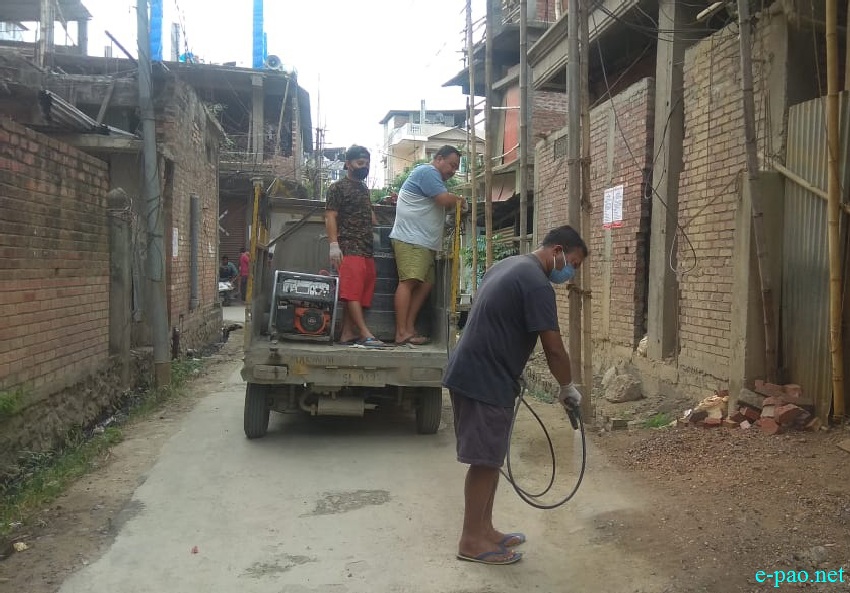 COVID-19 :: Distribution of Essential Items and disinfecting the road at Nagamapal, Imphal :: April 08 2020