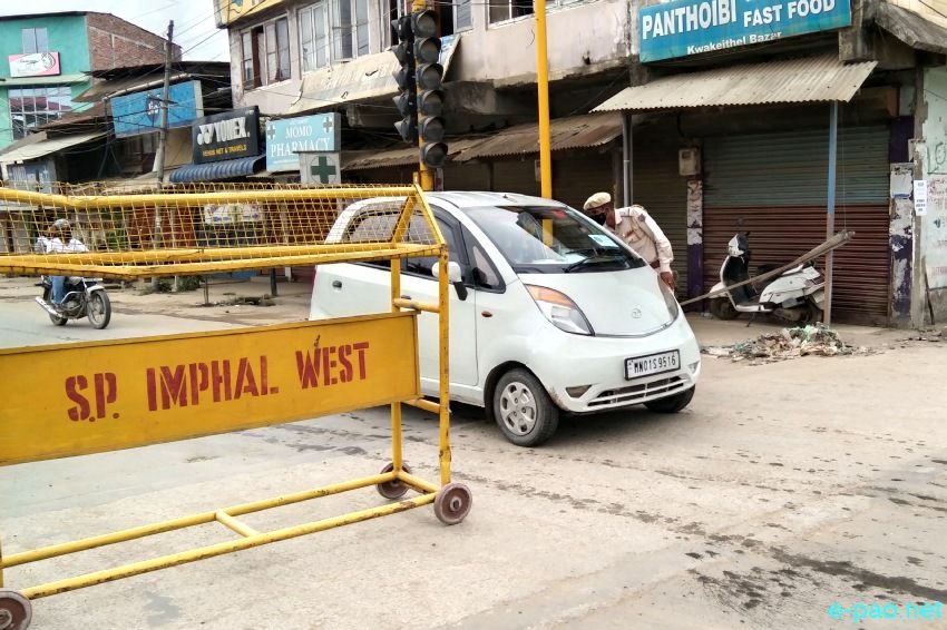  Imphal West District Police enforcing curfew in  Imphal on 18th July 2021 