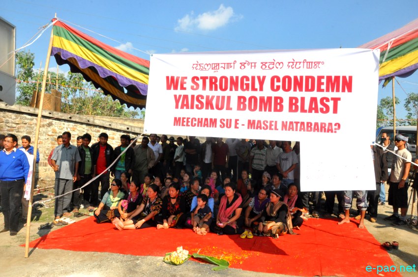 Floral tributes to the lifeless bodies at the bomb  blast site at Moirangkhom :: 31 October 2013