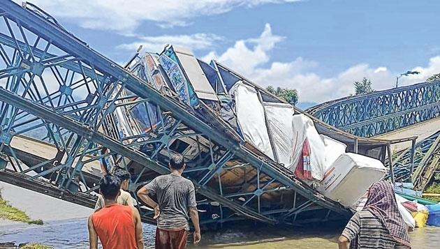 Bridge collapses, truck left hanging